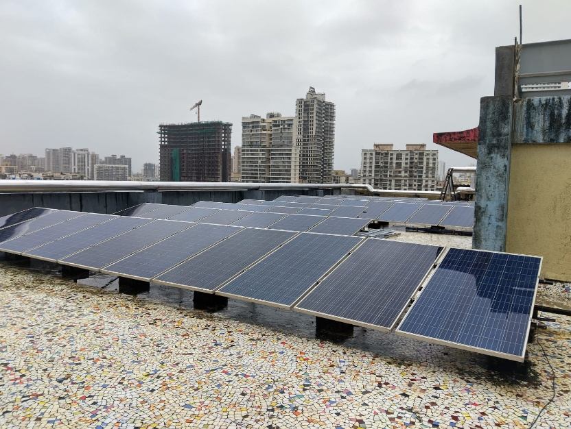 Rooftop solar panel installation on a commercial building in Navi Mumbai