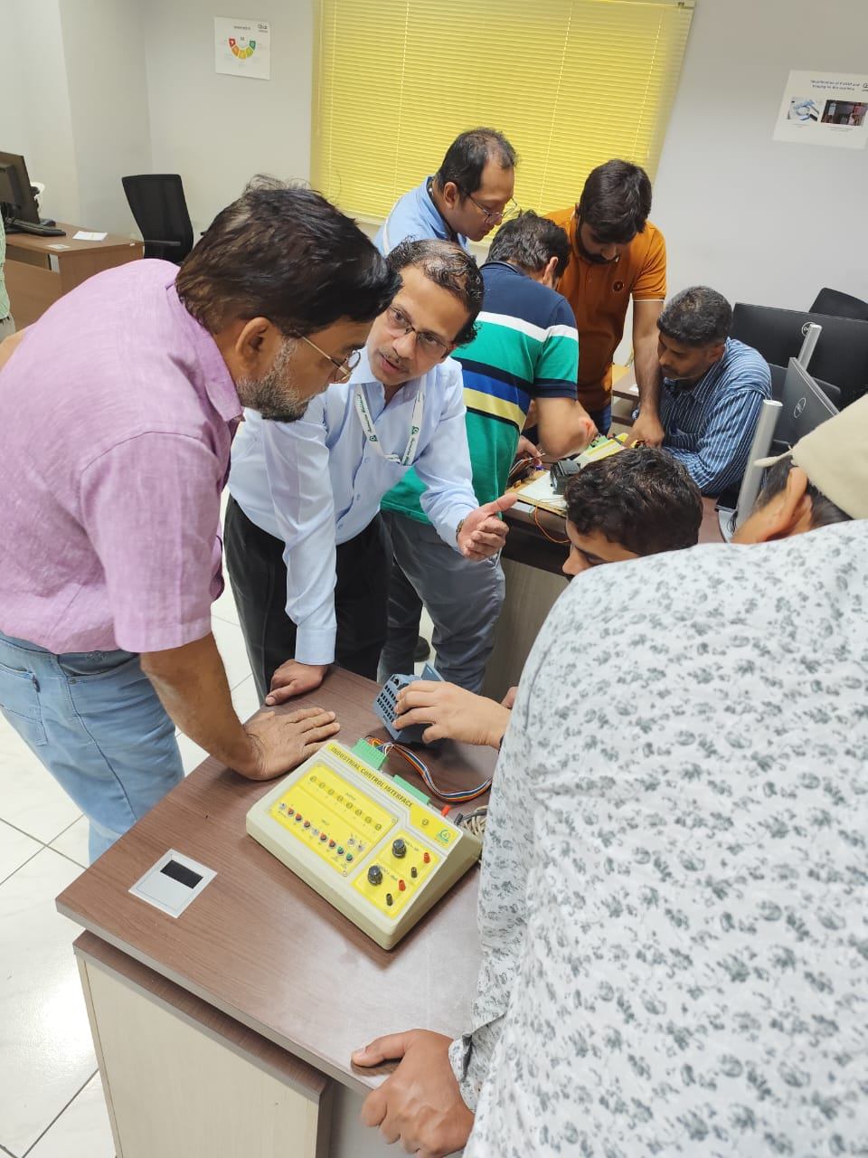 Hands-on industrial control training session with a practice kit